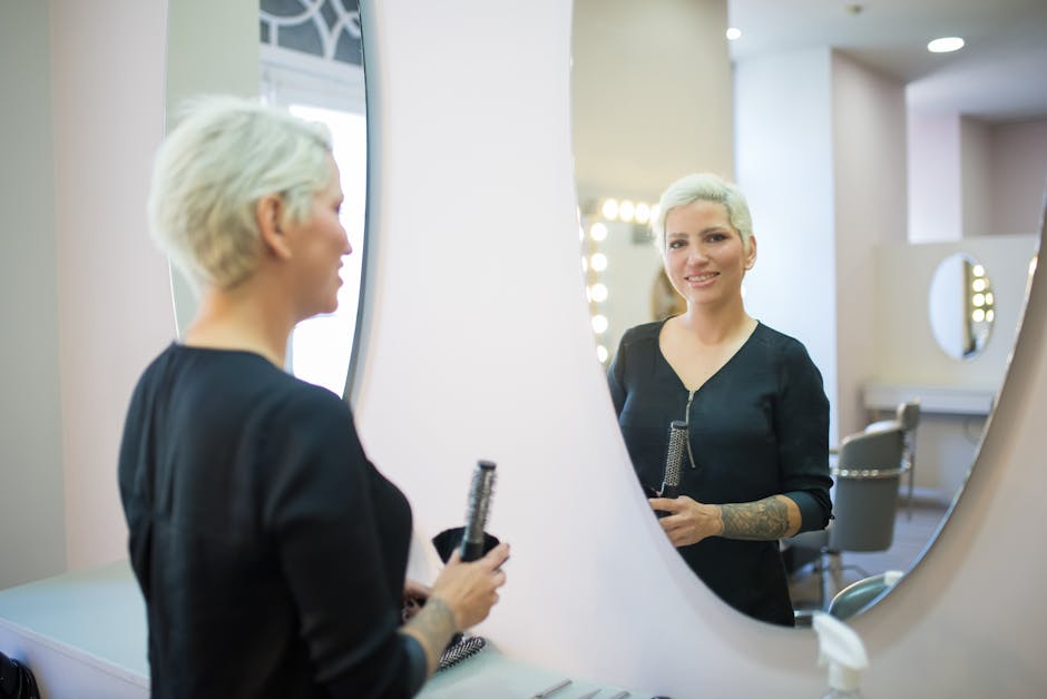 Hair salon reception workspace with paperwork and tablet