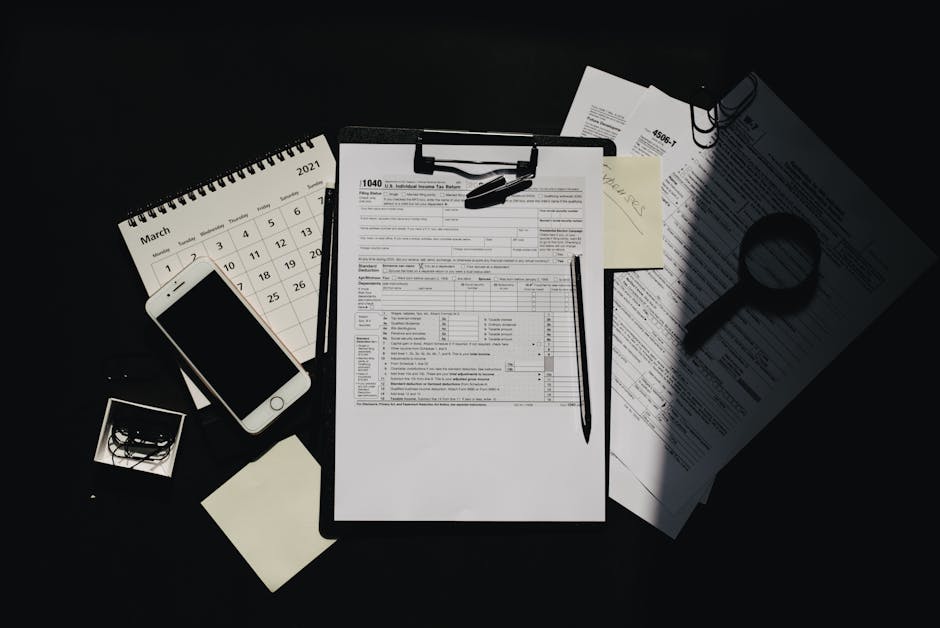 Receipts, smartphone, and laptop on a small business desk