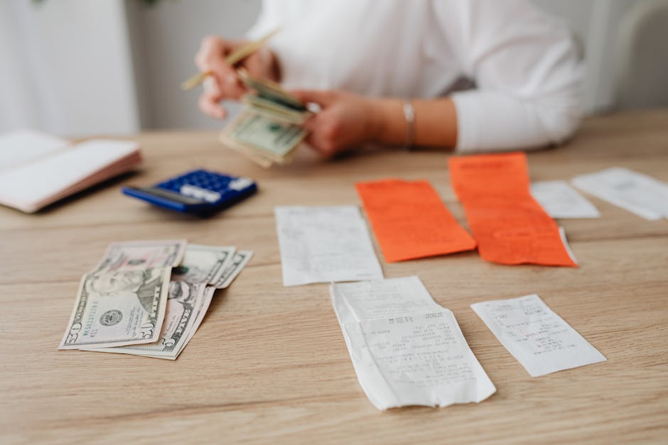 Accountant reviewing printed receipts with client