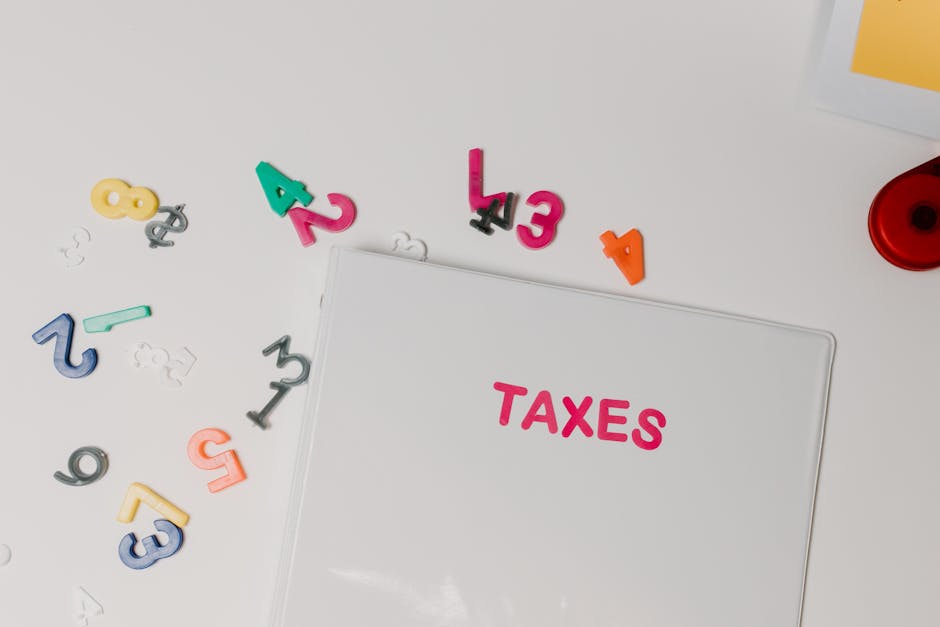 Receipts, smartphone, and laptop on a small business desk
